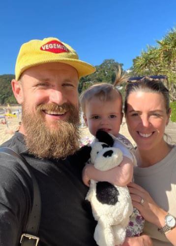 Andrew Redmayne with his wife Caitlin and daughter Poppy.